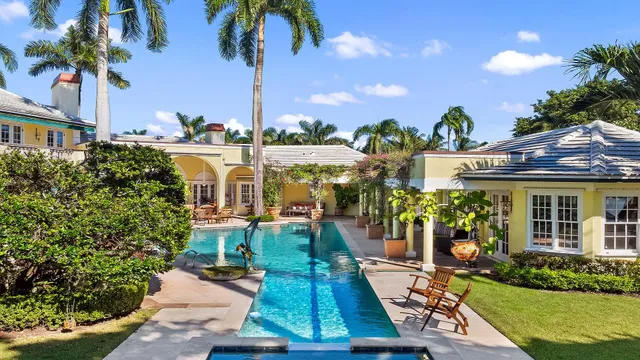 a front view of a building with garden view