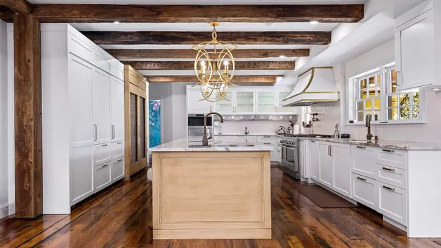 a kitchen with stainless steel appliances granite countertop a sink and cabinets