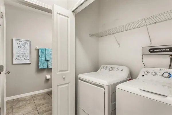 a utility room with dryer and washer