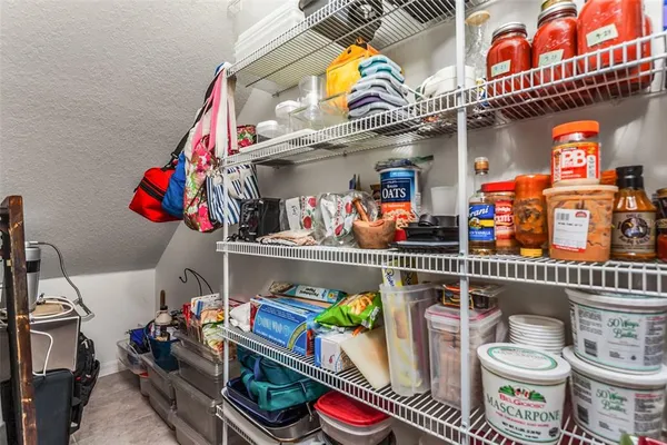 a store room with lots of fruit and vegetables
