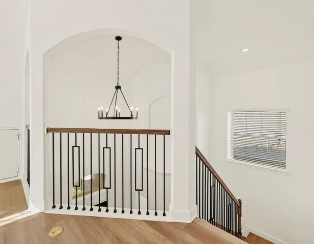 a view of a hallway with windows
