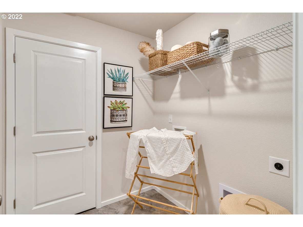 3122 Southeast 34th Way Gresham, OR 97080 - Photo 18 of 26 a bedroom with a bed and a chair