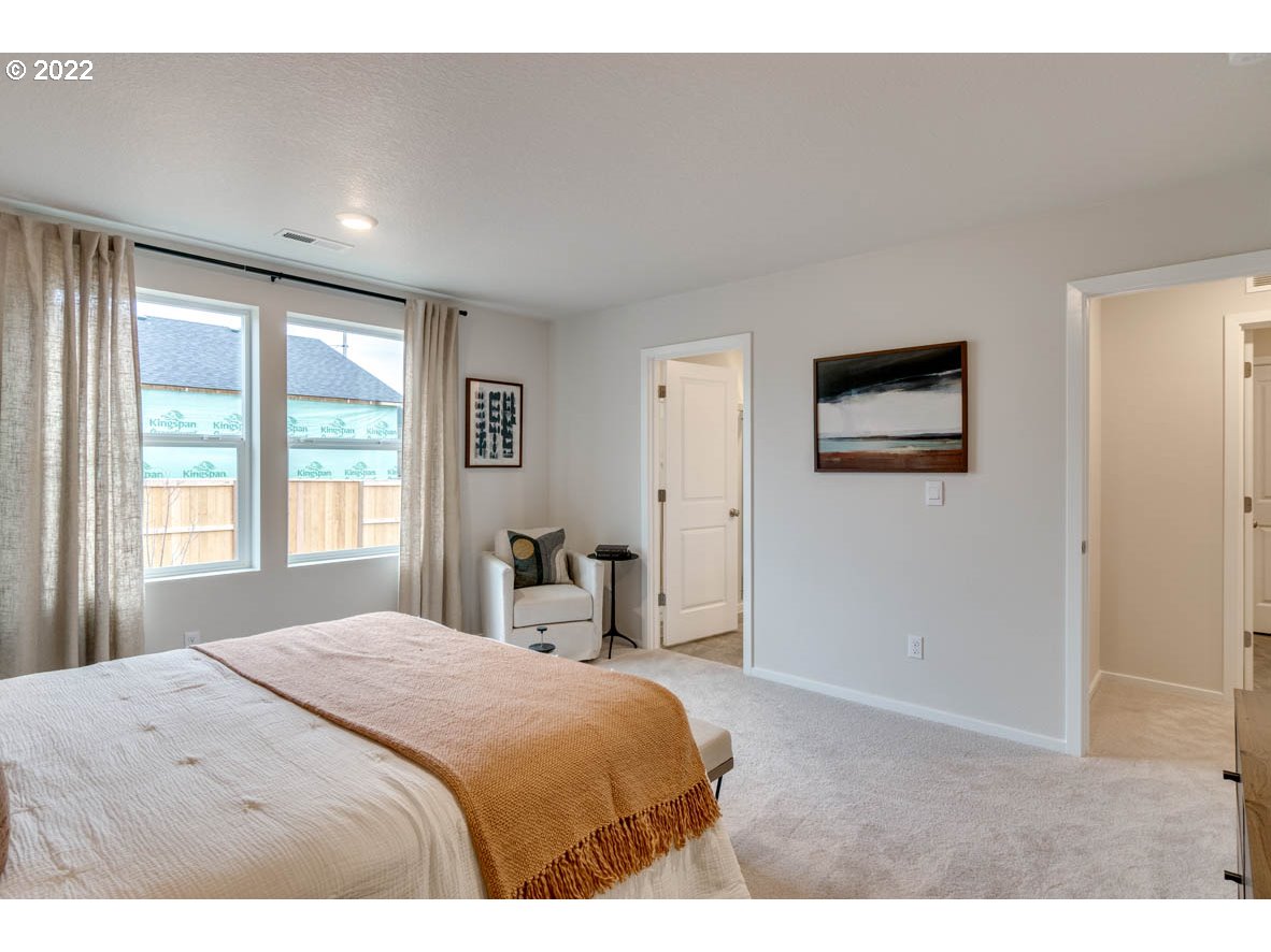 3122 Southeast 34th Way Gresham, OR 97080 - Photo 20 of 26 a bedroom with a large bed and a window