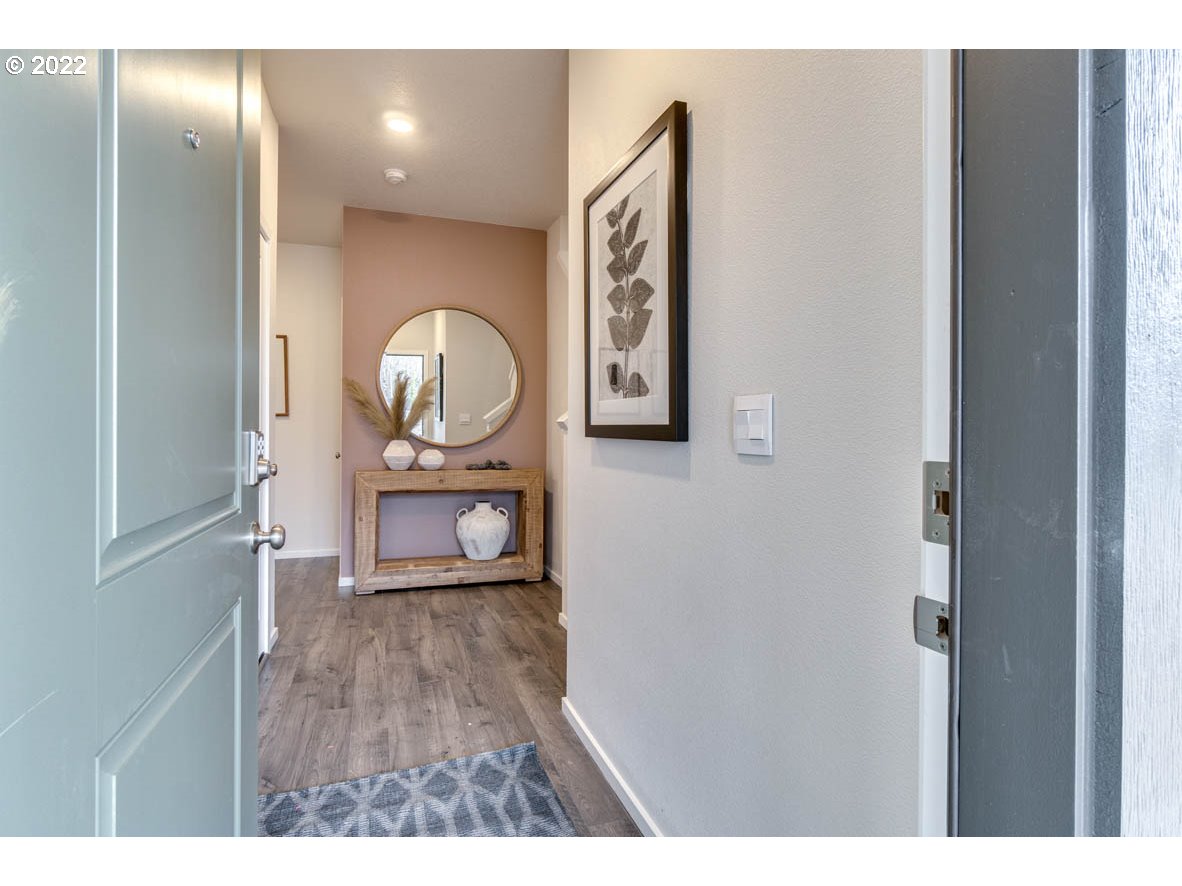 3122 Southeast 34th Way Gresham, OR 97080 - Photo 2 of 26 a view of a hallway with wooden floor