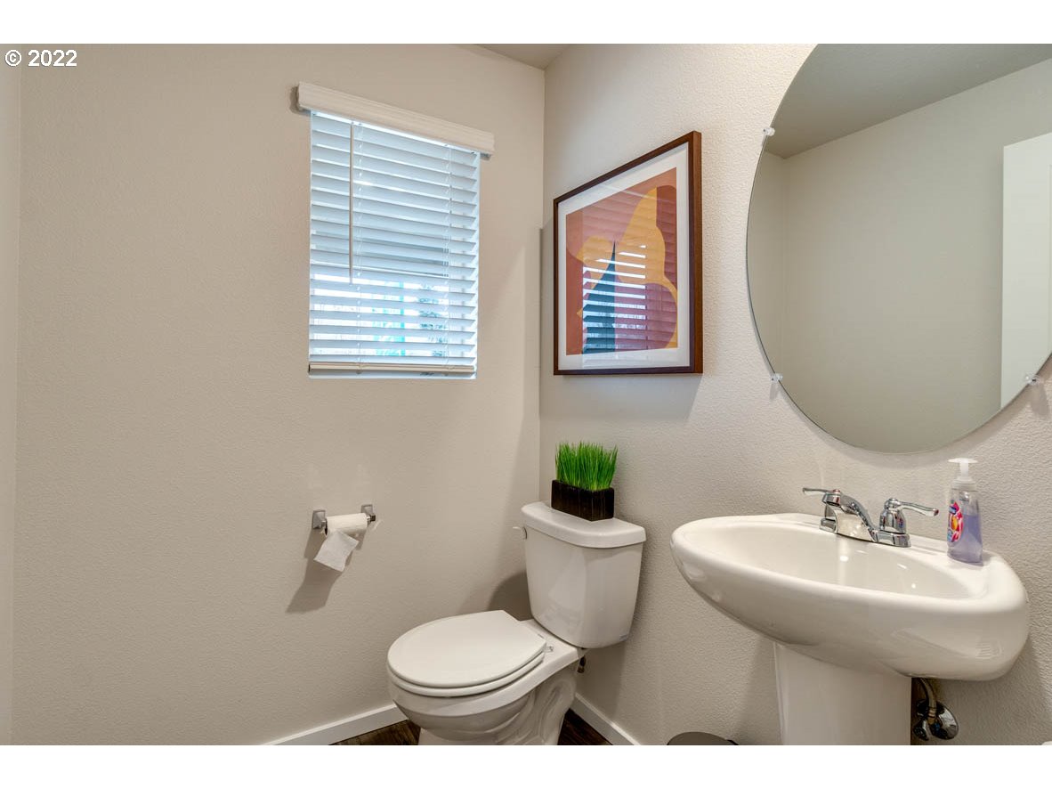 3122 Southeast 34th Way Gresham, OR 97080 - Photo 3 of 26 a bathroom with a toilet sink and mirror