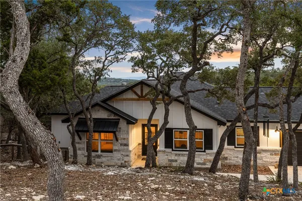 a view of a house with a tree