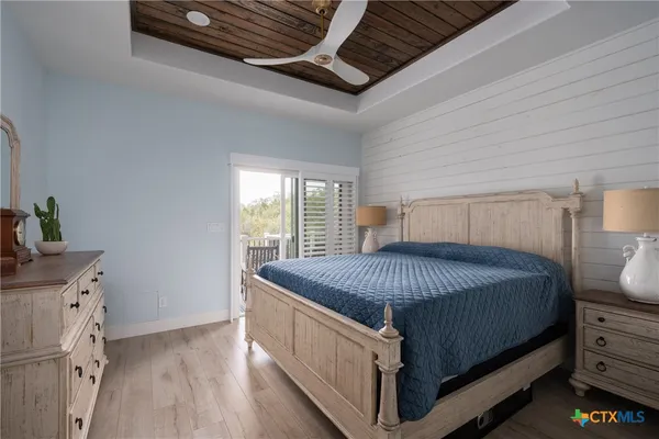 a bedroom with a bed and a dresser
