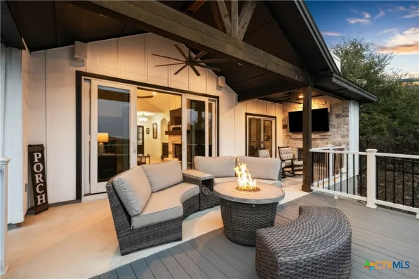a view of roof deck with furniture