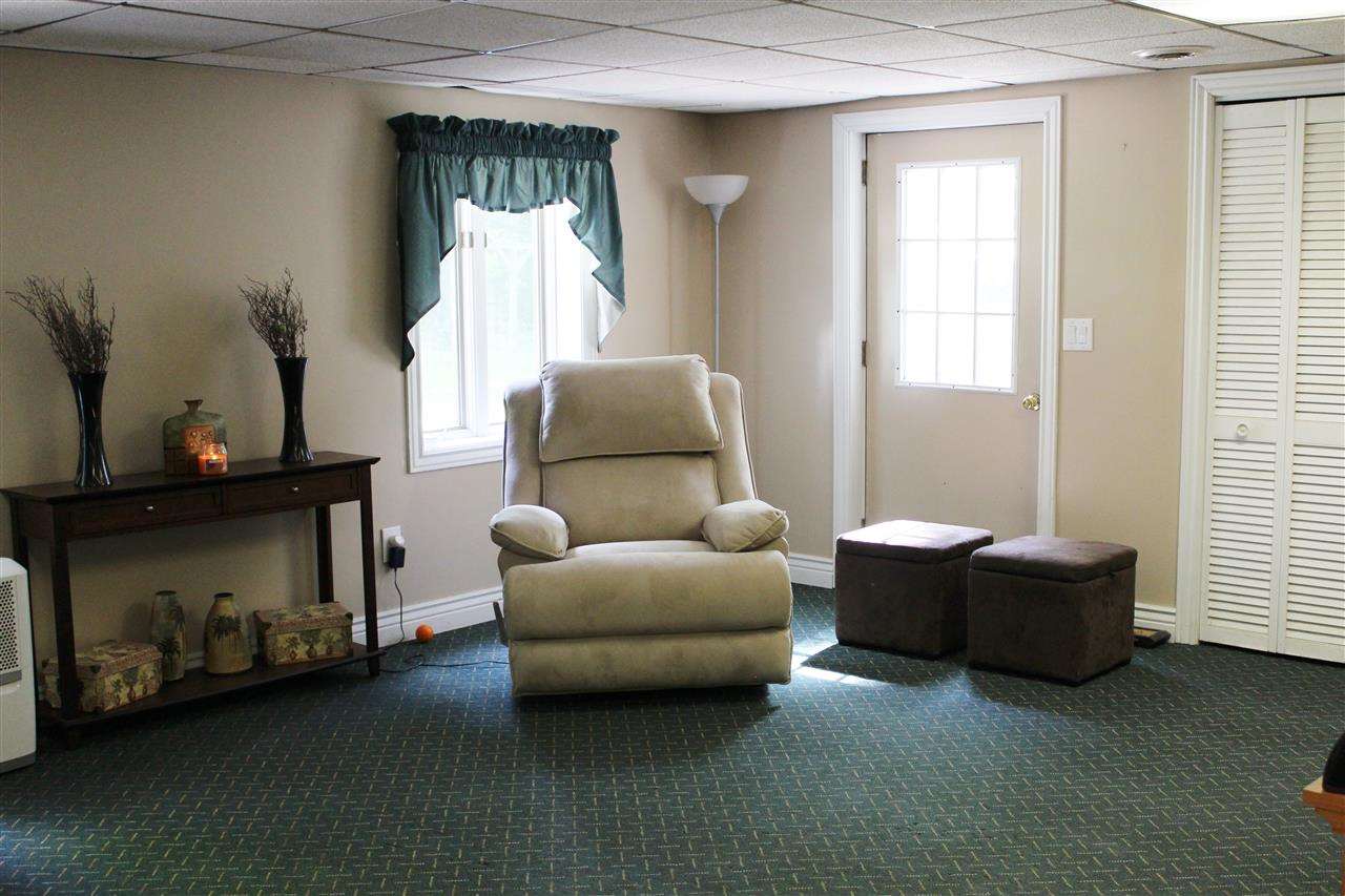 3385 Mertz Road Caro, MI 48723 - Photo 14 of 22 There is plenty of light in the finished family room in the walk out basement