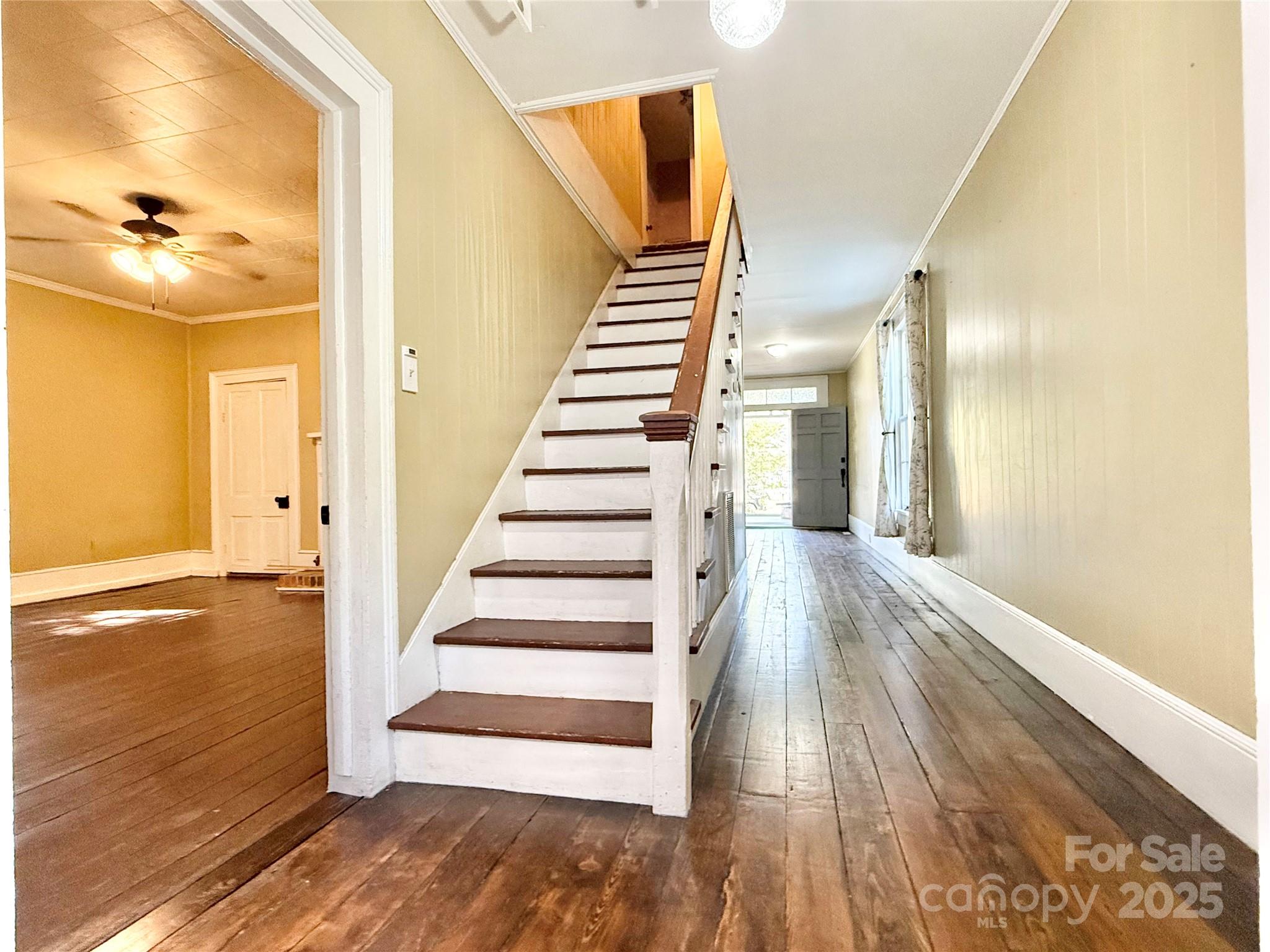 117 Pine Street Chester, SC 29706 - Photo 11 of 19 a view of front door and bedroom with wooden floor