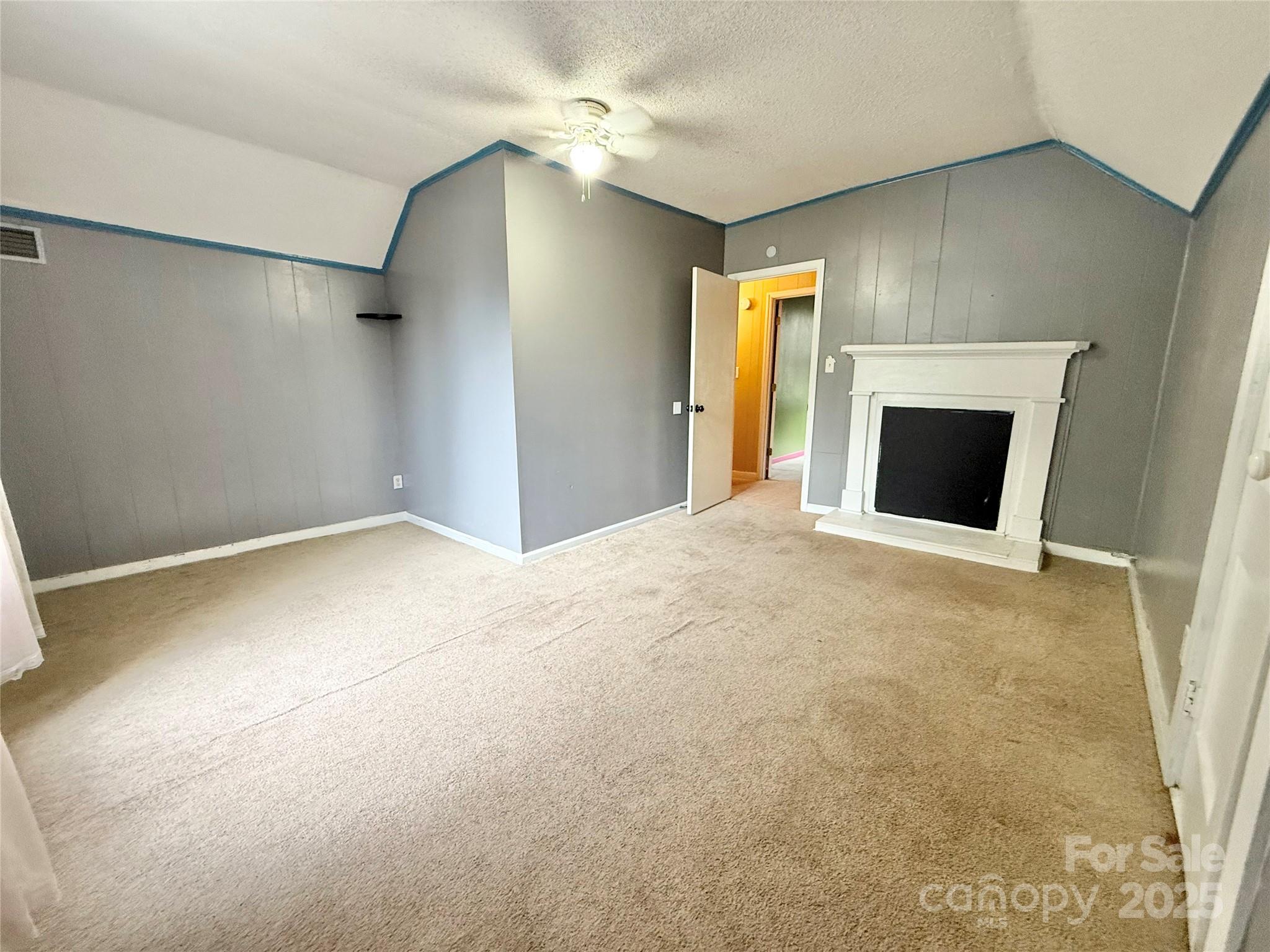 117 Pine Street Chester, SC 29706 - Photo 13 of 19 a view of an empty room with a fireplace