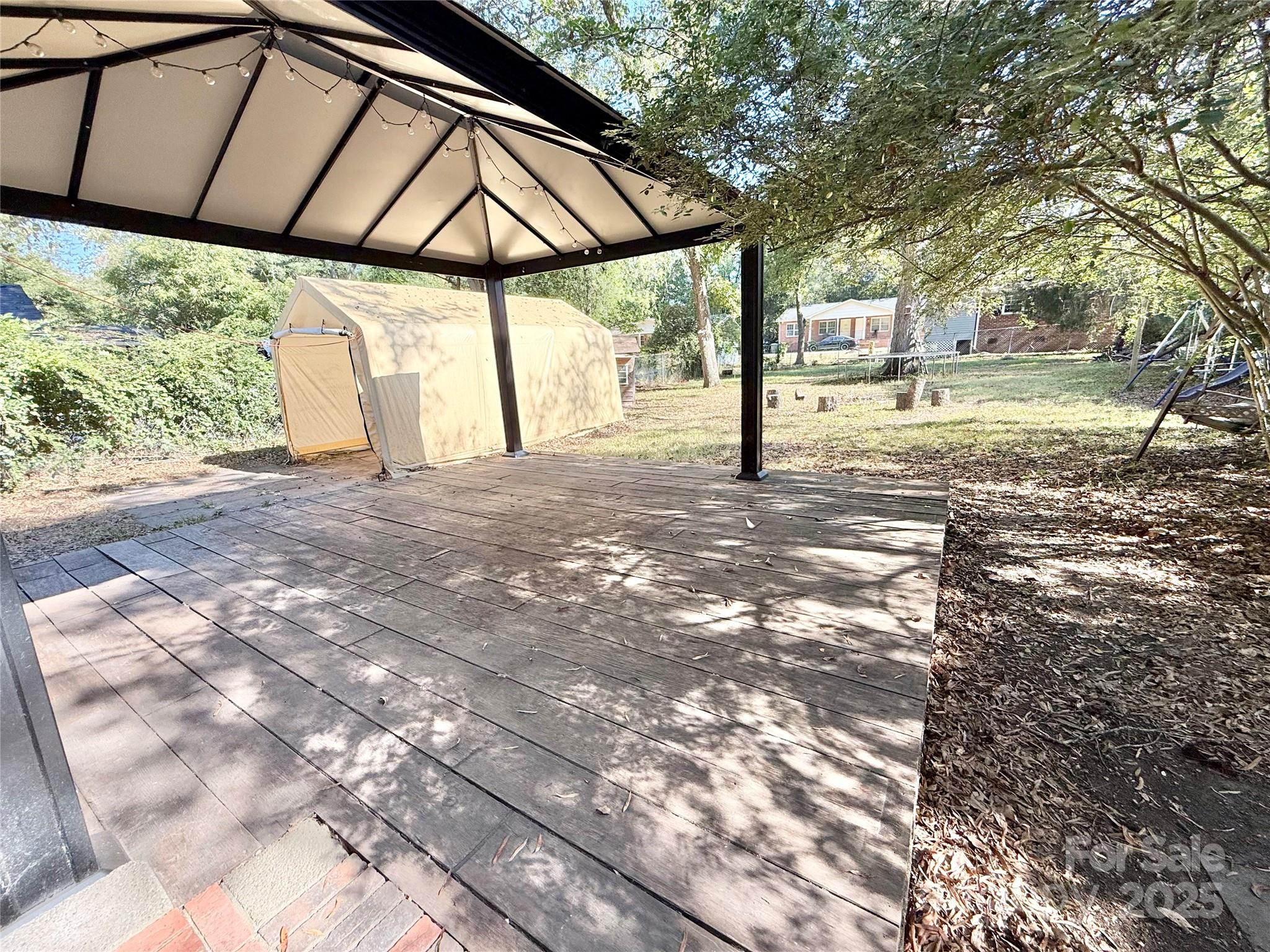 117 Pine Street Chester, SC 29706 - Photo 18 of 19 a view of a yard with table and chairs under an umbrella
