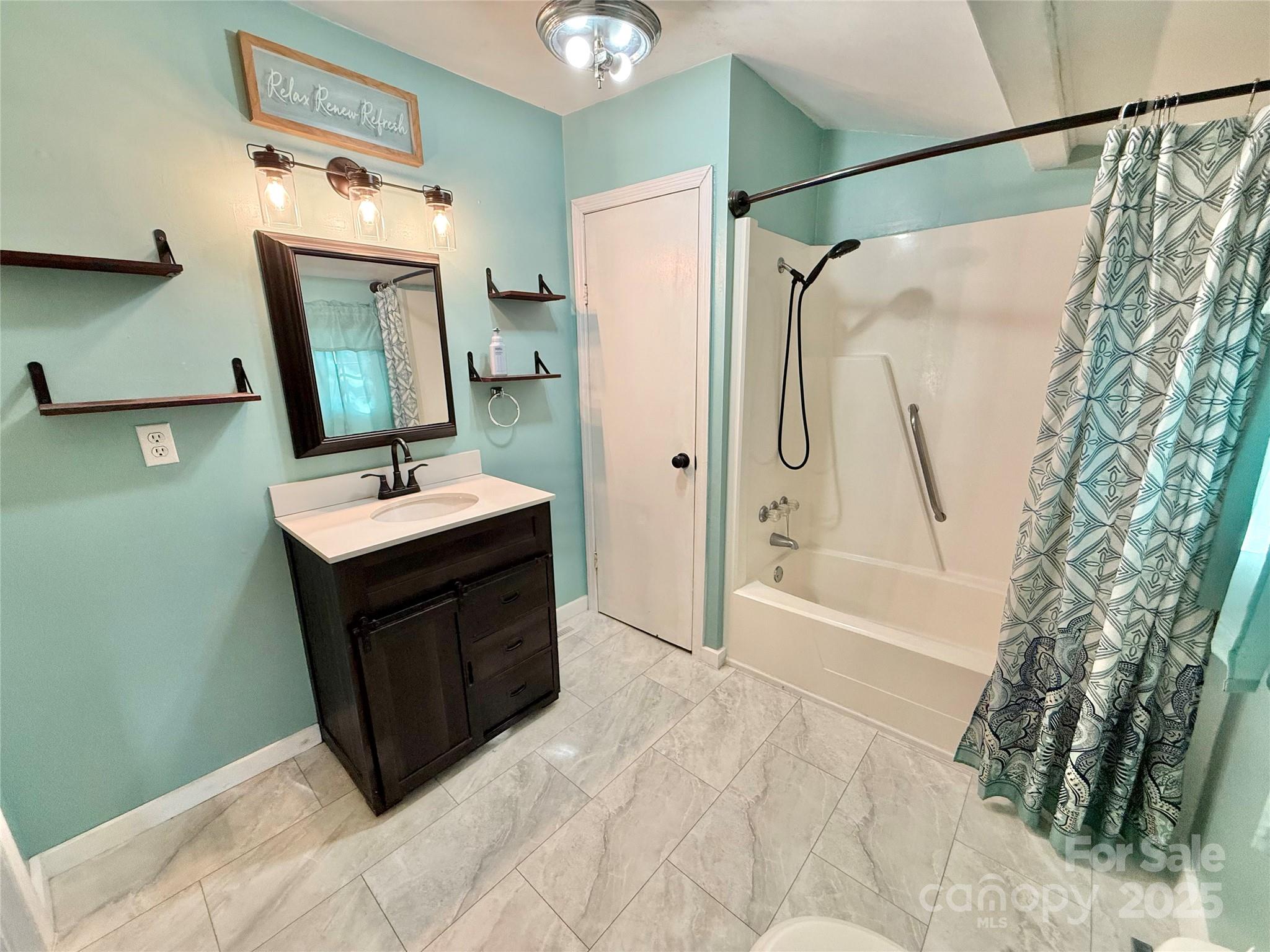 117 Pine Street Chester, SC 29706 - Photo 7 of 19 a bathroom with a sink and a mirror