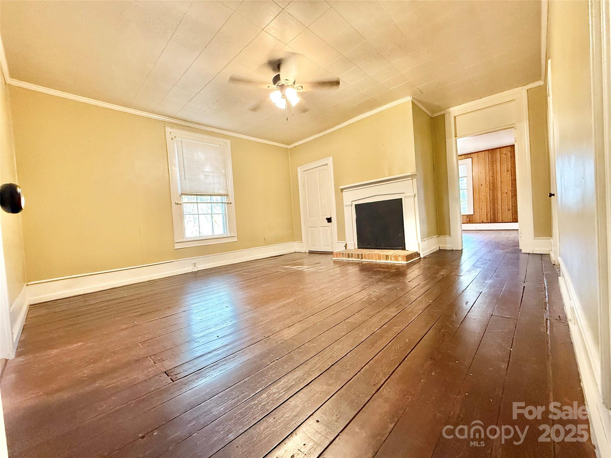 117 Pine Street Chester, SC 29706 - Photo 10 of 19 a view of an empty room with wooden floor and a window