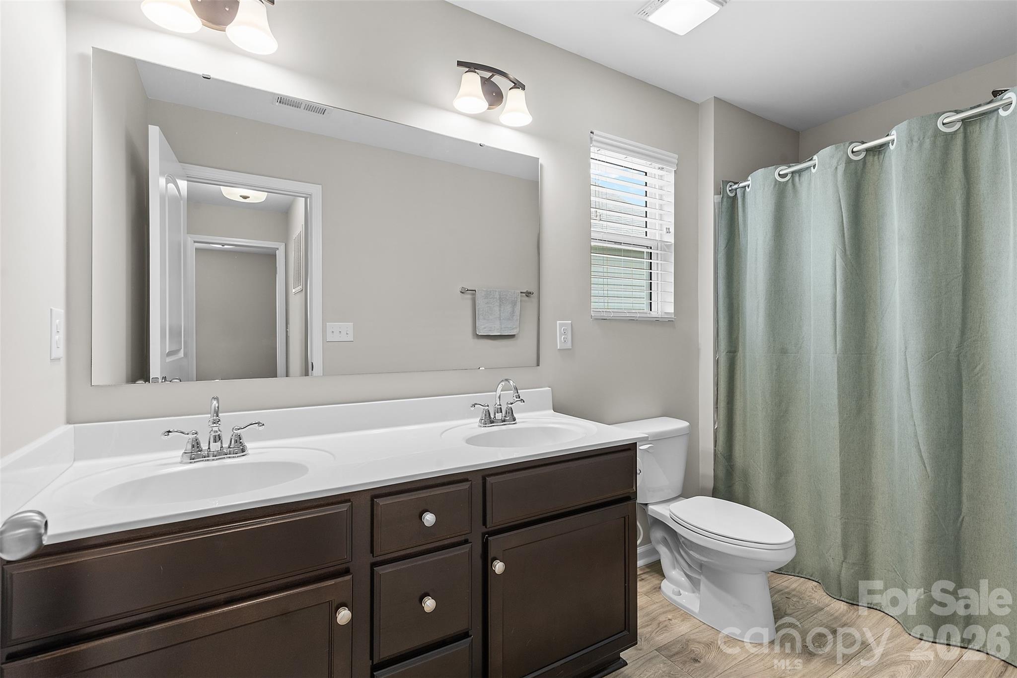 209 Shay Xing Road Salisbury, NC 28146 - Photo 15 of 20 a bathroom with a toilet sink and mirror