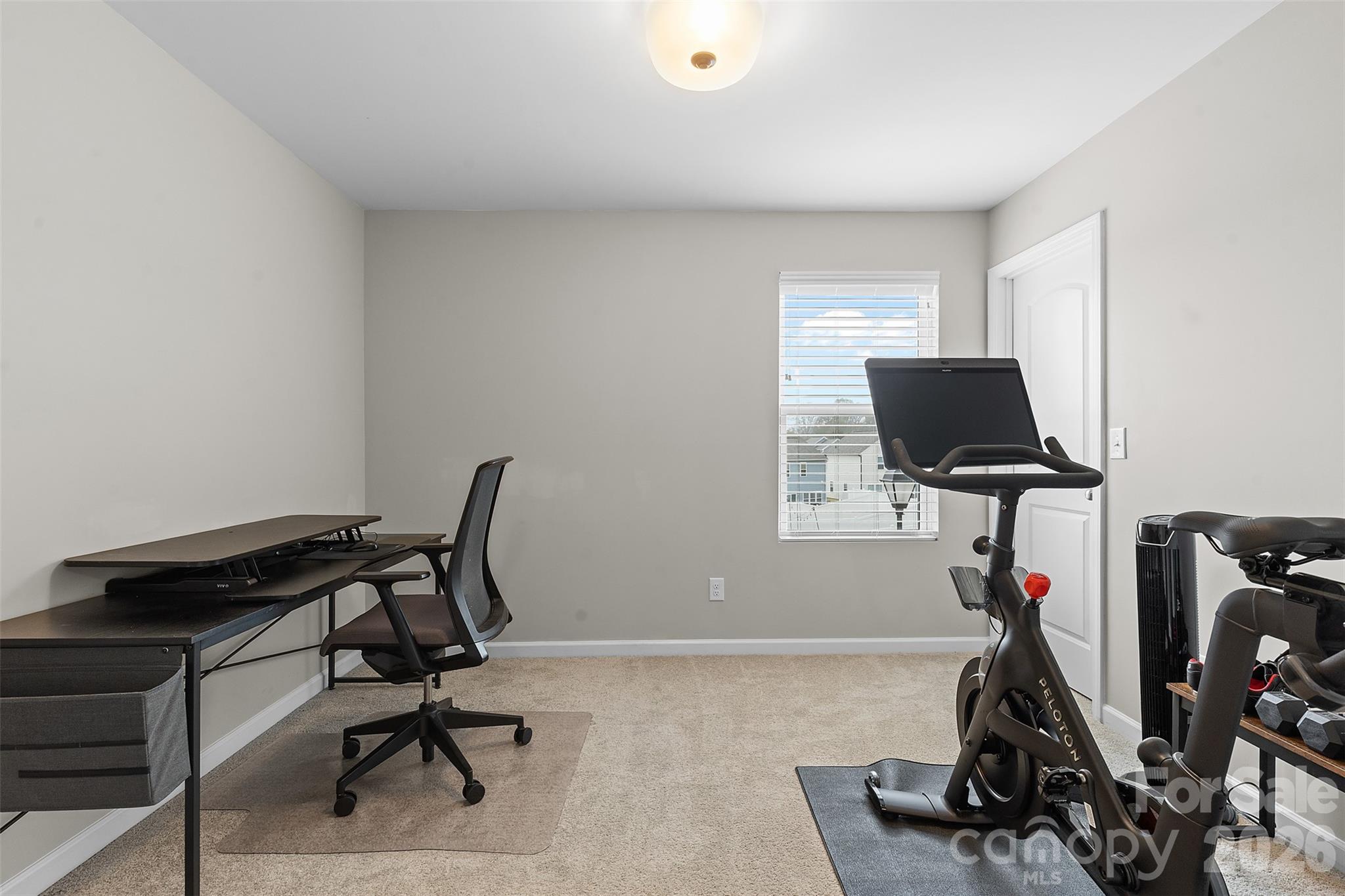 209 Shay Xing Road Salisbury, NC 28146 - Photo 16 of 20 a view of a workspace with furniture and a gym cycle