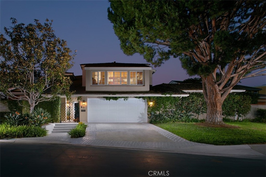 2 Rue Chantilly Newport Beach, CA 92660 - Photo 1 of 1 a front view of a house with garden