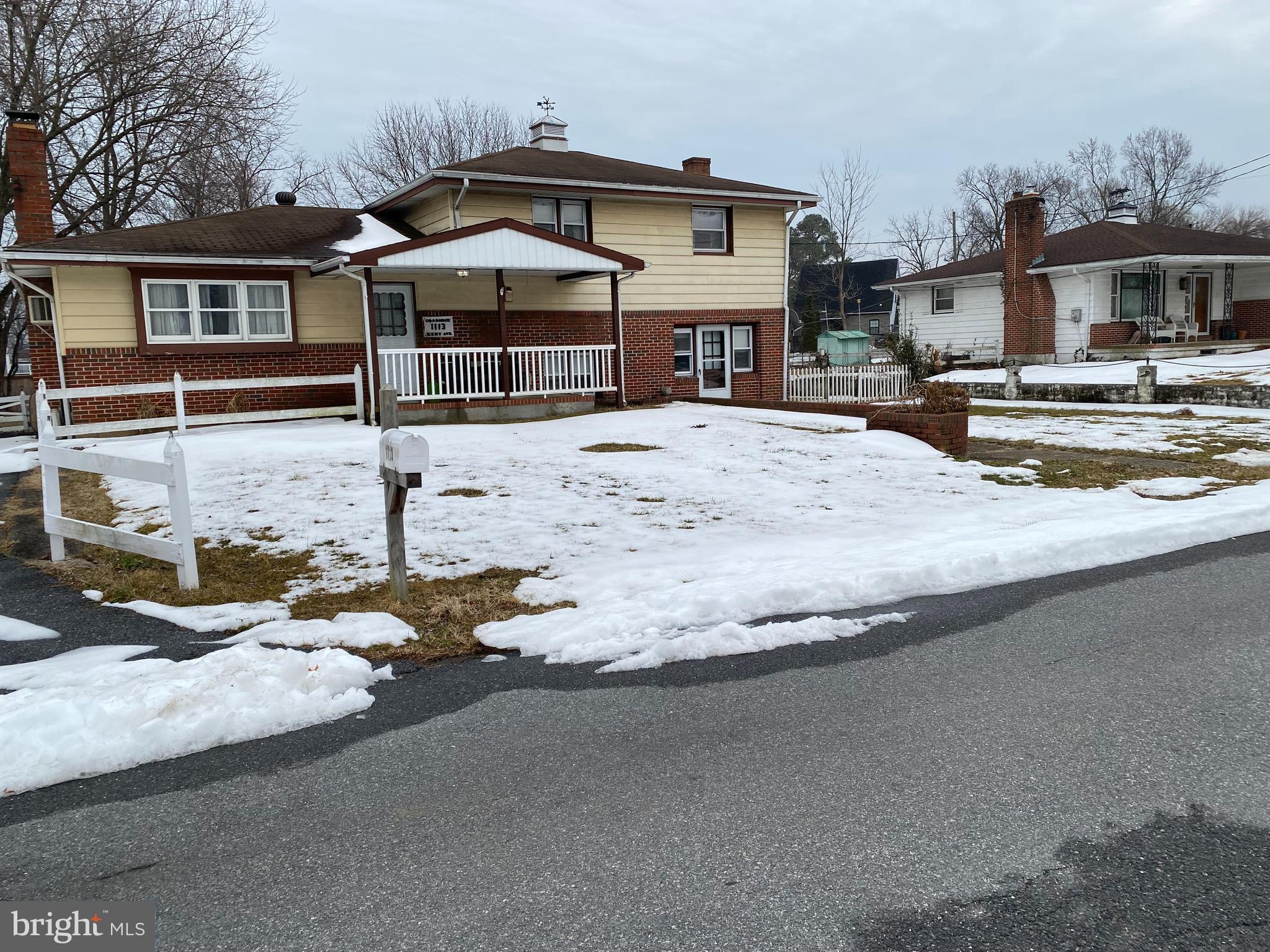 1113 Kent Avenue Baltimore, MD 21207 - Photo 2 of 4 a front view of a house with a yard