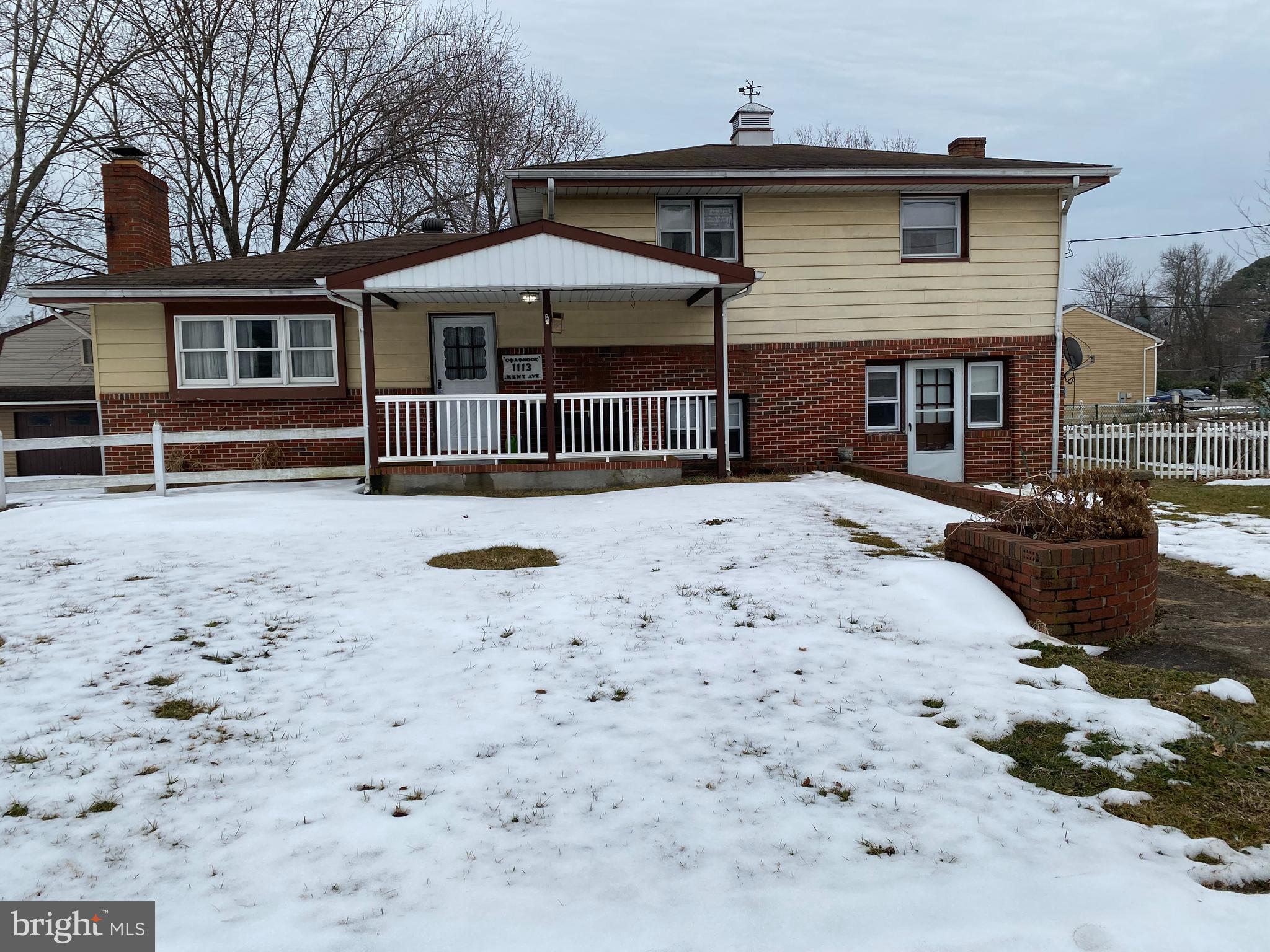 1113 Kent Avenue Baltimore, MD 21207 - Photo 4 of 4 a front view of a house with a yard