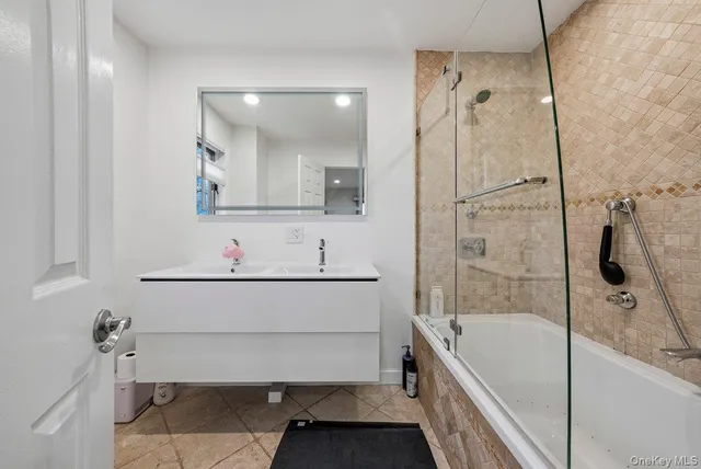 a bathroom with a bathtub and a sink