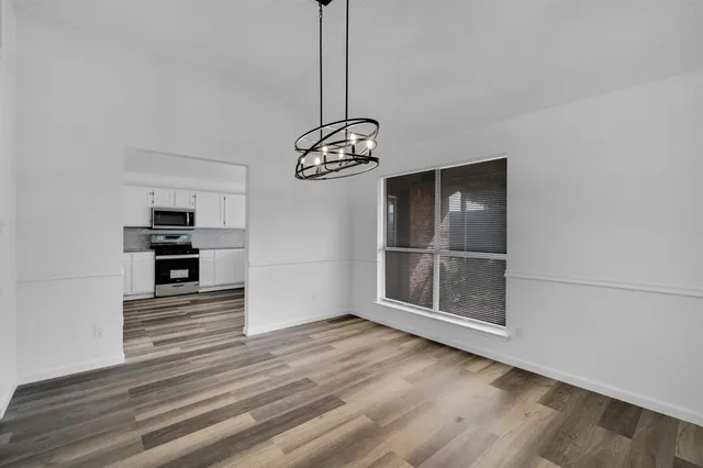 a view of a kitchen with an oven and cabinets
