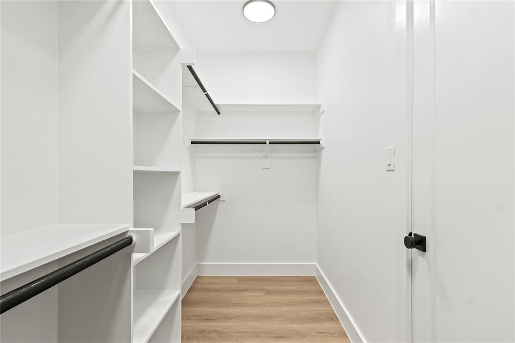 4827 Baldwin Street Dallas, TX 75210 - Photo 15 of 21 a view of entryway and hall with wooden floor