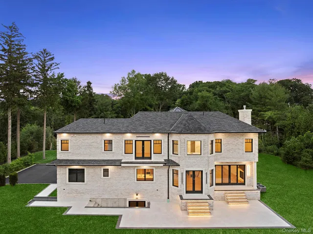 a aerial view of a house next to a yard