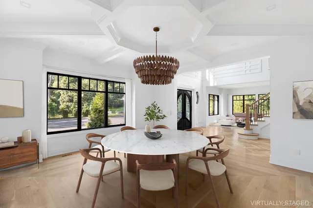 a view of a dining room with furniture window and wooden floor