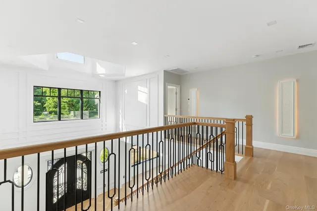 a view of a hallway with windows