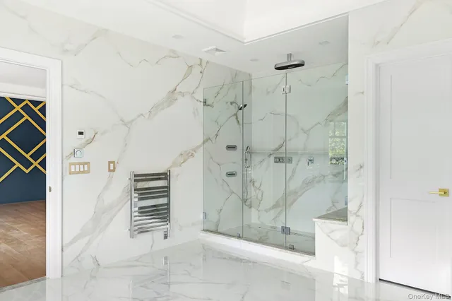 a bathroom with a shower and a sink