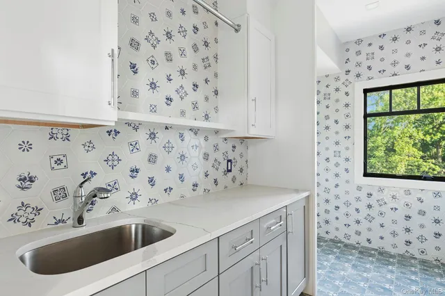 a bathroom with a sink a toilet and a shower curtain