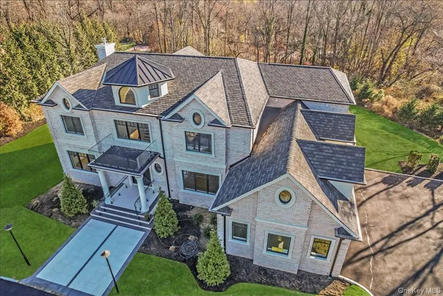 a aerial view of a house with a yard