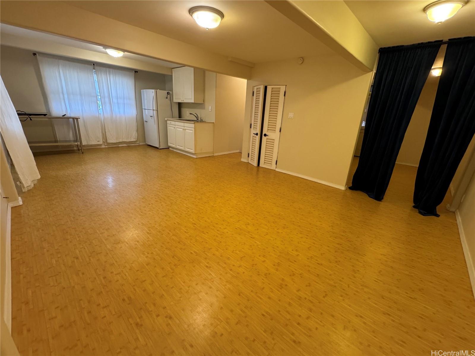 320 Hao Street Honolulu, HI 96821 - Photo 5 of 15 a view of an empty room with a kitchen