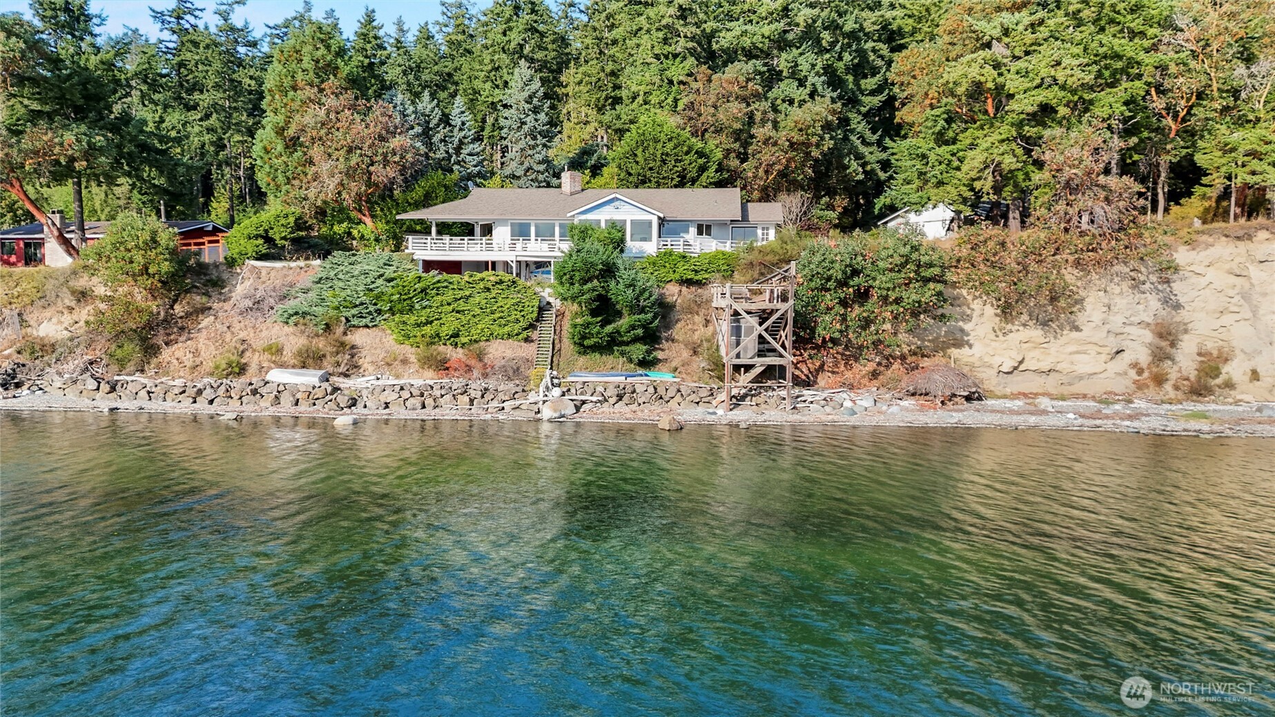a view of a lake with a house in the background