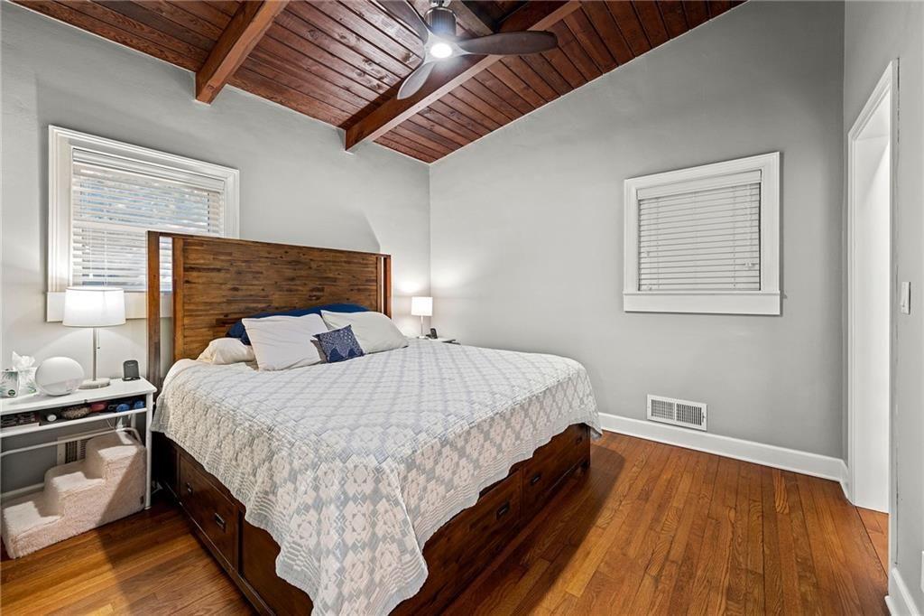 2632 Defoors Ferry Road Northwest Atlanta, GA 30318 - Photo 13 of 22 a bed sitting in a bedroom next to a window