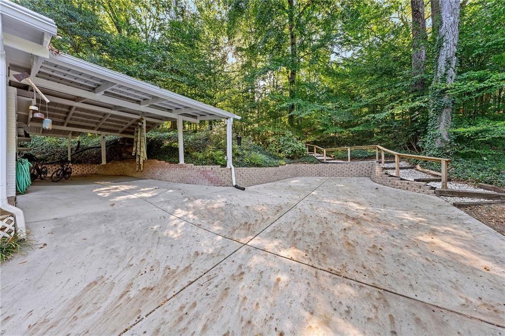 2632 Defoors Ferry Road Northwest Atlanta, GA 30318 - Photo 20 of 22 a view of a house with backyard and sitting area