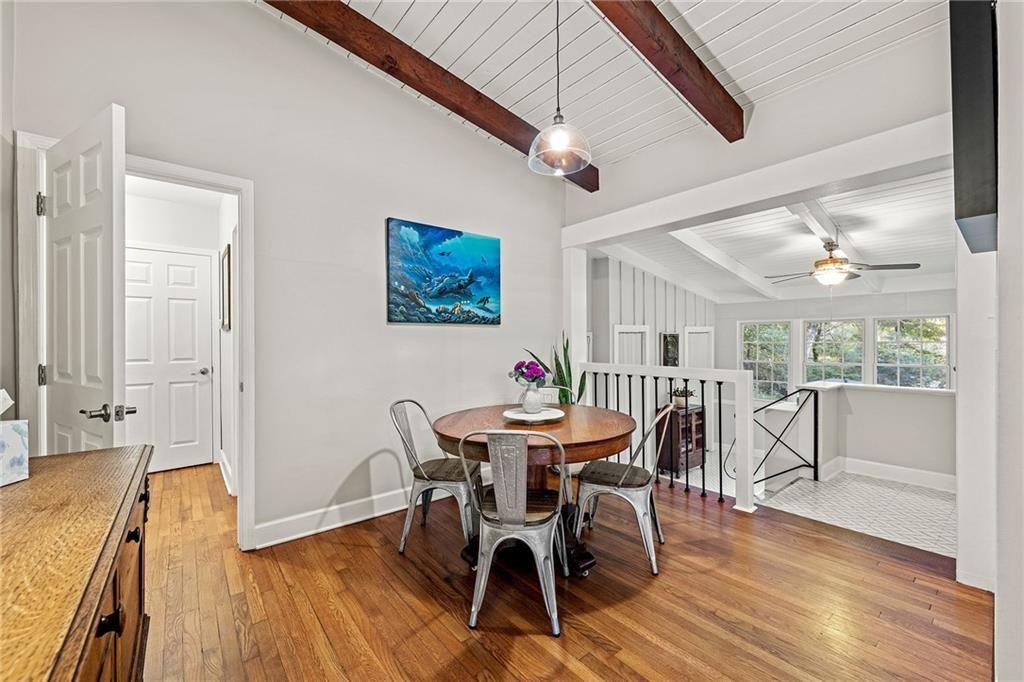 2632 Defoors Ferry Road Northwest Atlanta, GA 30318 - Photo 6 of 22 a view of a dining room with furniture window and wooden floor