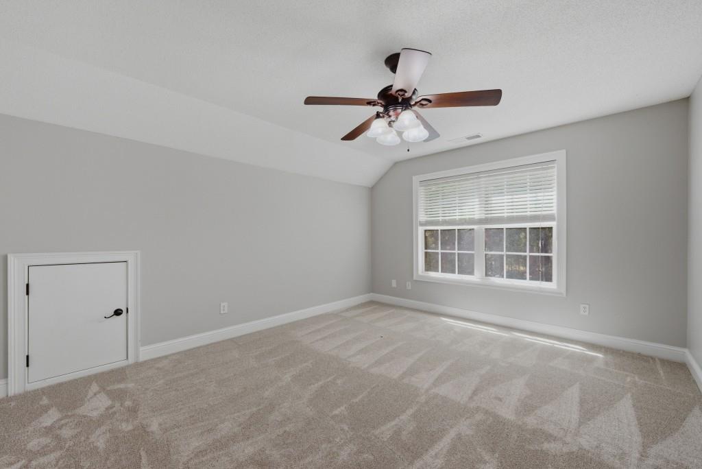 582 Knox Chapel Road Social Circle, GA 30025 - Photo 29 of 49 a view of an empty room with a window