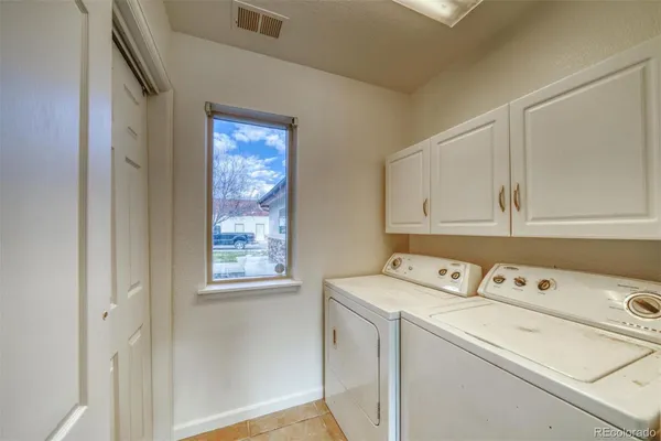 a bathroom with a granite countertop sink a mirror and shower