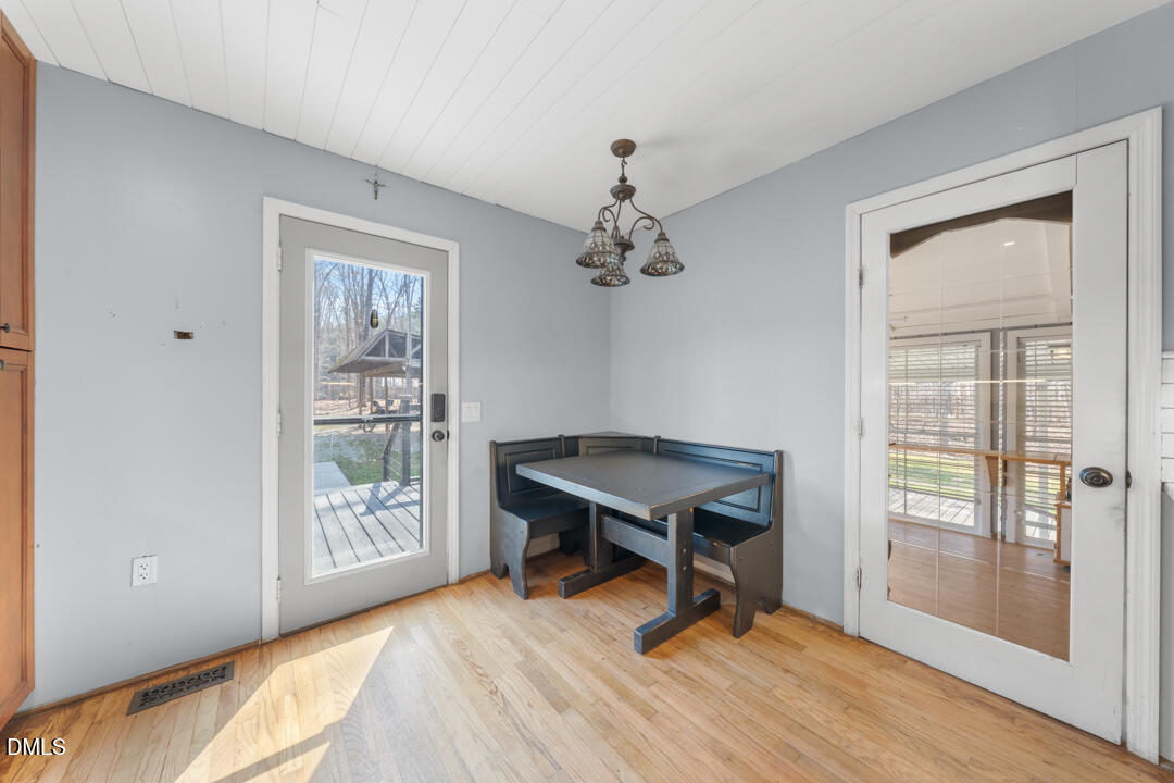 4739 Wild Azalea Place Rougemont, NC 27572 - Photo 13 of 48 a view of a workspace with wooden floor and a window