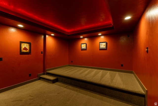 3565 West 1350th Street North Vernal, UT 84078 - Photo 38 of 54 Theater room featuring red walls, recessed lighting, and a tiered carpeted platform
