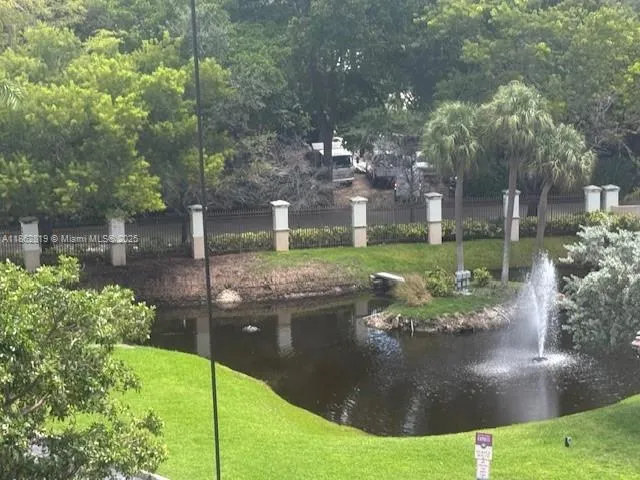 a view of a garden with a fountain