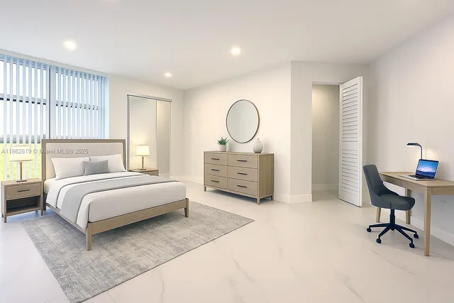 a bedroom with a bed a chandelier and a window