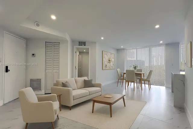 a living room with furniture and a table