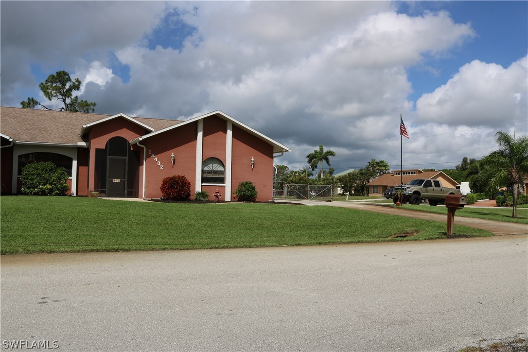 18432 Olive Road Fort Myers, FL 33967 - Photo 1 of 18 a view of a house with a back yard