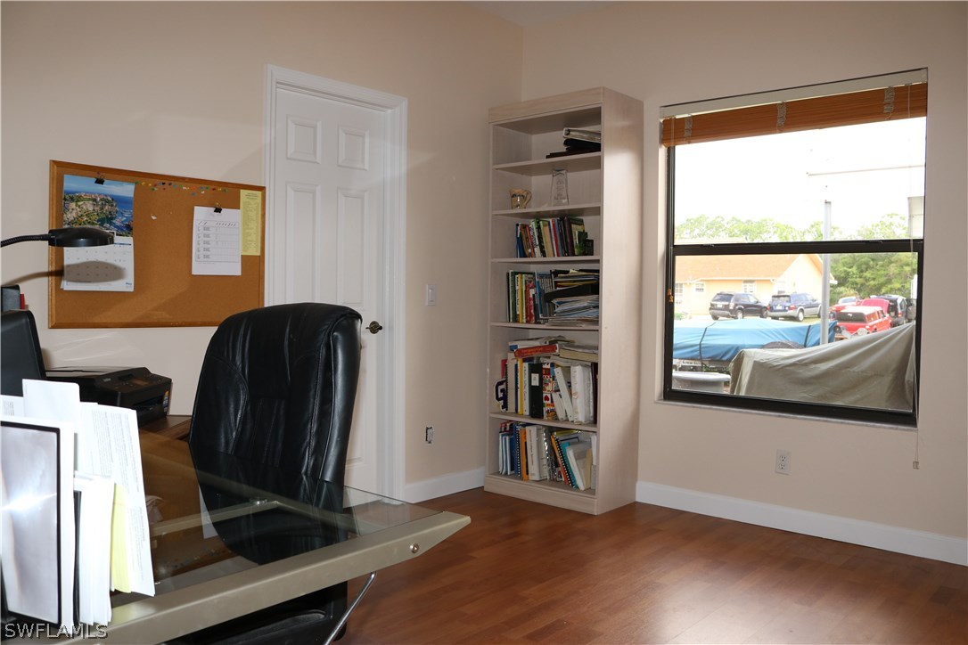 18432 Olive Road Fort Myers, FL 33967 - Photo 11 of 18 a view of a workspace with furniture and a window