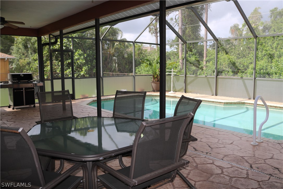 18432 Olive Road Fort Myers, FL 33967 - Photo 15 of 18 a view of a dining room with furniture wooden floor and a potted plant