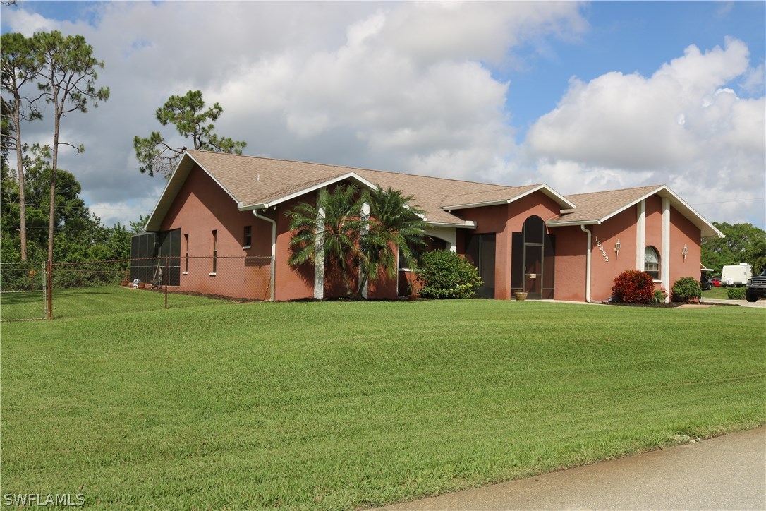 18432 Olive Road Fort Myers, FL 33967 - Photo 3 of 18 a front view of house with yard and green space