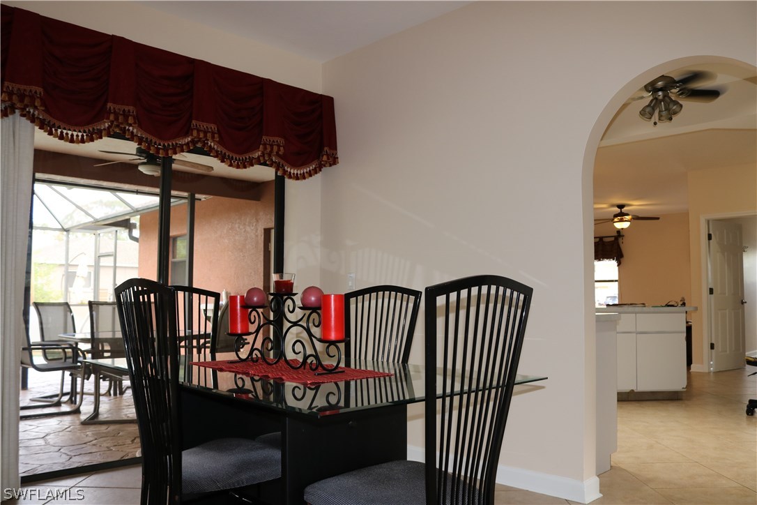 18432 Olive Road Fort Myers, FL 33967 - Photo 4 of 18 a view of a dining room with furniture and chandelier