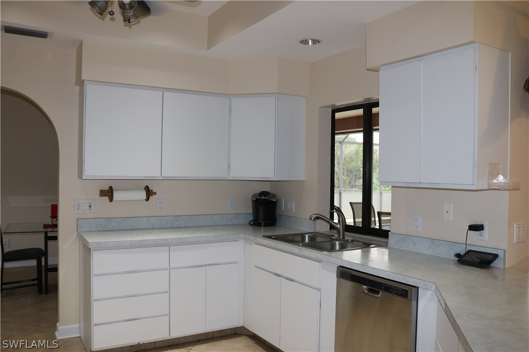 18432 Olive Road Fort Myers, FL 33967 - Photo 6 of 18 a kitchen with a sink cabinets and window